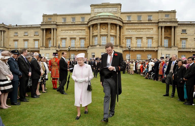 Queen Elizabeth II arrives to attend a garden party at Buckingham Palace in London May 22. Buckingham Palace, the Queen's London, will stage its first football match in October as part of the Football Association's 150th anniversary celebrations, the FA announced Tuesday