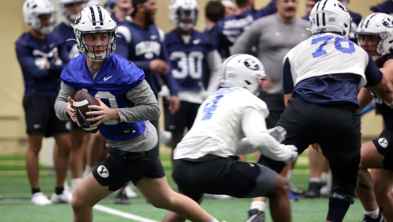 BYU quarterback Kedon Solvis looks to make a pass during opening day of BYU spring football camp at the BYU Indoor Practice Facility in Provo, on Monday, March 6, 2023.