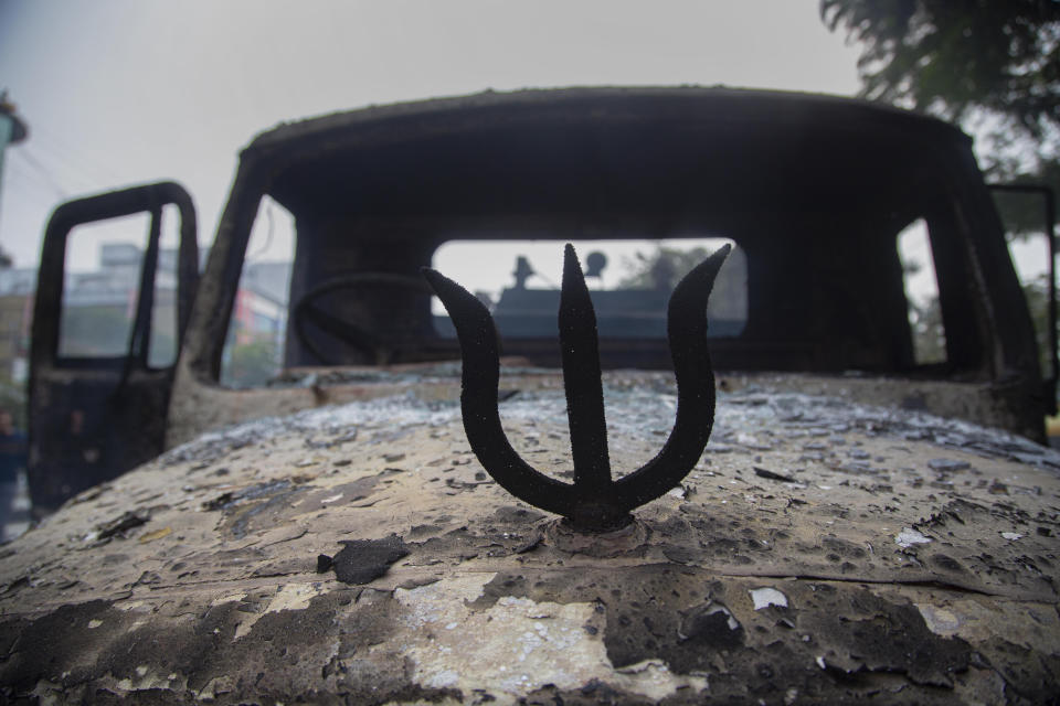 FILE - A trident is seen on car vandalized during a protest against the Citizenship Amendment Bill (CAB), a controversial citizenship review process that has already left nearly two million people in Assam state potentially stateless, in Gauhati, India Dec. 12, 2019. As India, the world’s largest democracy, celebrates 75 years of independence on Aug. 15, 2022, its independent judiciary, diverse media and minorities are buckling under the strain, putting its democracy under pressure. (AP Photo/Anupam Nath, File)