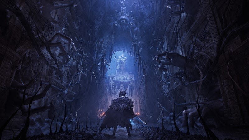 A Lords of the Fallen character looks down a creepy hall toward what appears to be some sort of statue.