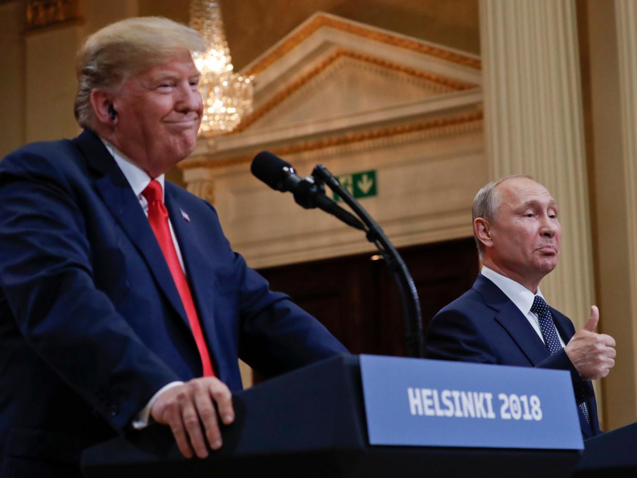 FILE - In this July 16, 2018, file photo Russian President Vladimir Putin, right, and U.S. President Donald Trump give a joint news conference at the Presidential Palace in Helsinki, Finland. For the past three years, the administration has careered between President Donald Trump's attempts to curry favor and friendship with Vladimir Putin and longstanding deep-seated concerns about Putin's intentions. (AP Photo/Pablo Martinez Monsivais, File)