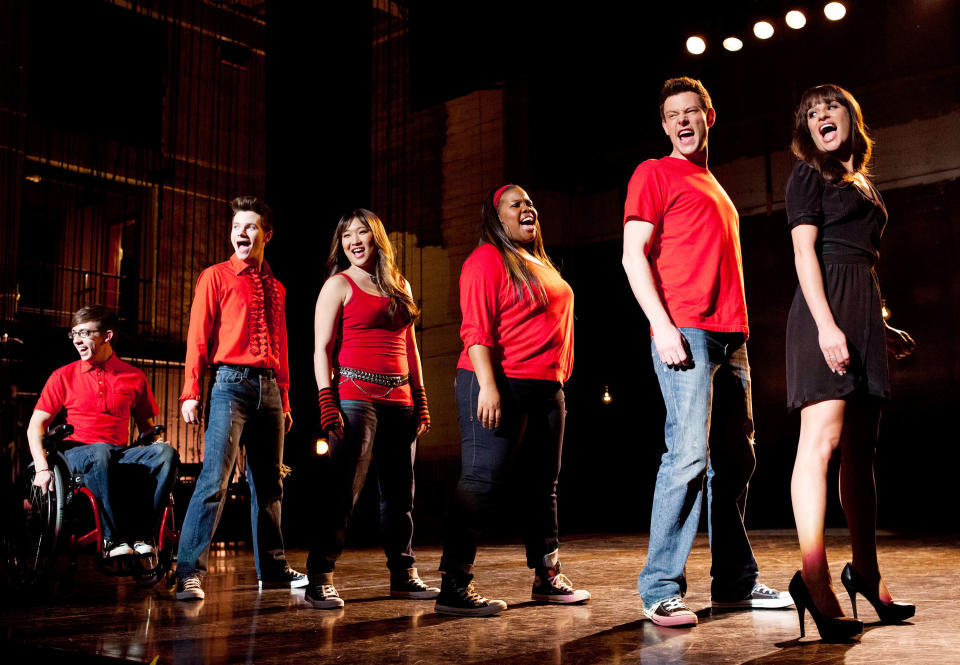 Glee cast singing on stage