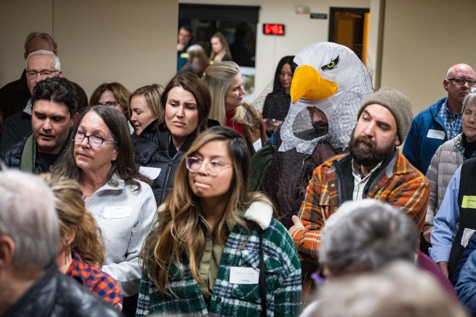 Timnath resident Brent Myers, dressed as an eagle, attends at a public meeting with Ladera developers at Colorado Youth Outdoors on Tuesday, Feb. 13, 2023 in Fort Collins, Colo. Some in attendance cited potential harm from the proposed Topgolf facility to resident eagles.