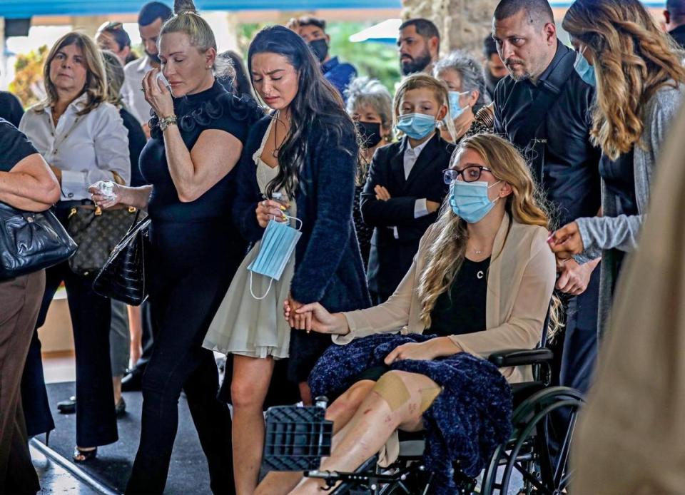 Tayler Scheinhaus, and her sister, Deven Gonzalez, hold hands as they arrive for their father’s funeral, Edgar Gonzalez, at Christ Fellowship Church in Palmetto Bay on Friday, July 23, 2021. Edgar Gonzalez died during the collapse of the 12-story oceanfront condo, Champlain Towers South in Surfside.