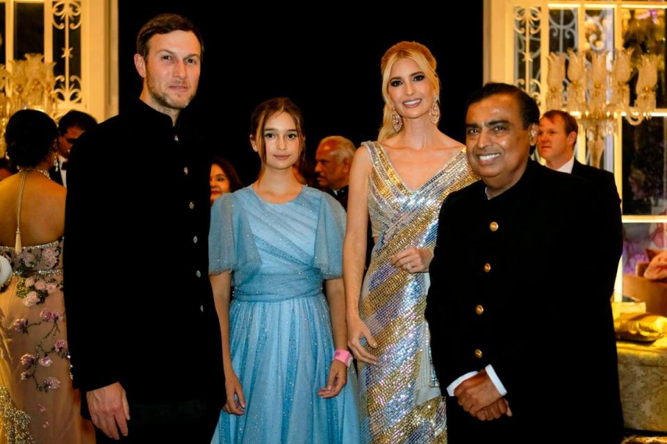 This photograph released by the Reliance group shows from L to R, Jared Kushner, daughter Arabella and Ivanka Trump posing for a photograph with billionaire industrialist Mukesh Ambani, right, at a pre-wedding bash of Ambani’s son Anant Ambani in Jamnagar, India, Friday, 1 March 202 (AP)