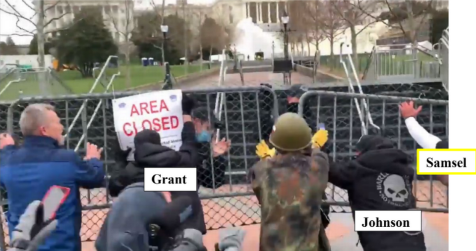 Cary resident James Grant storms a security fence outside the U.S. Capitol on Jan. 6, 2021, as police try to keep him and other rioters out. A federal judge in Washington, D.C., found Grant guilty of multiple felonies and misdemeanors on Friday, Feb. 2, 2024.