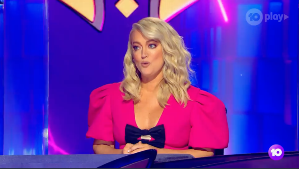 Jackie O wearing a pink dress on The Masked Singer