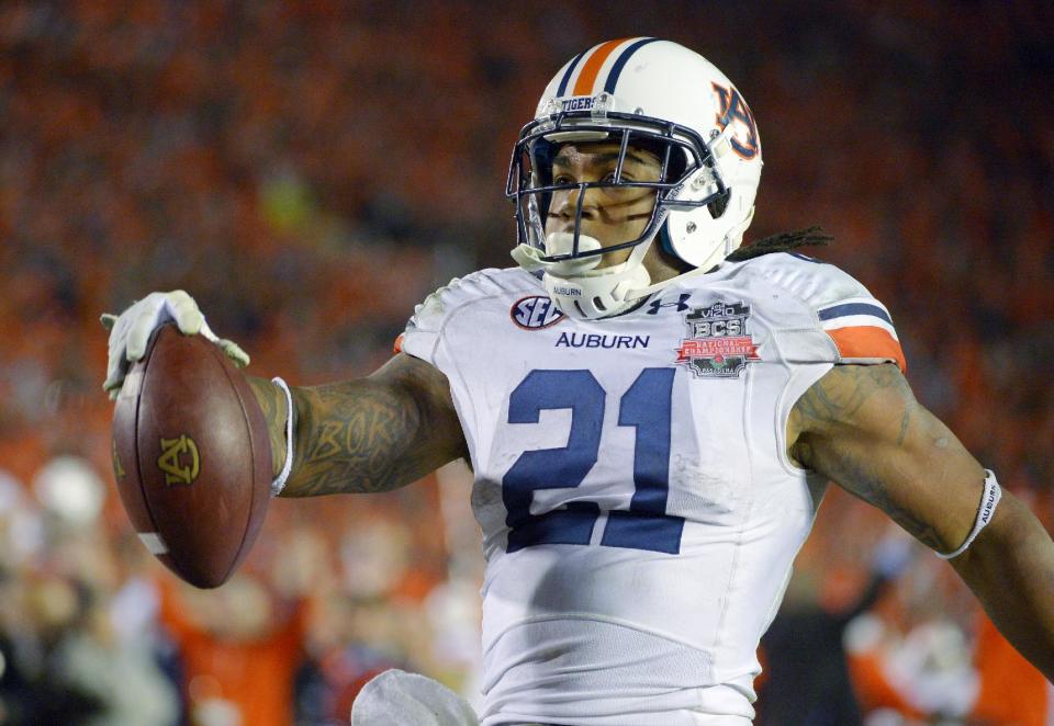 Auburn's Tre Mason heads into the end zone for a touchdown run during the second half of the NCAA BCS National Championship college football game against Florida State Monday, Jan. 6, 2014, in Pasadena, Calif. (AP Photo/Mark J. Terrill)