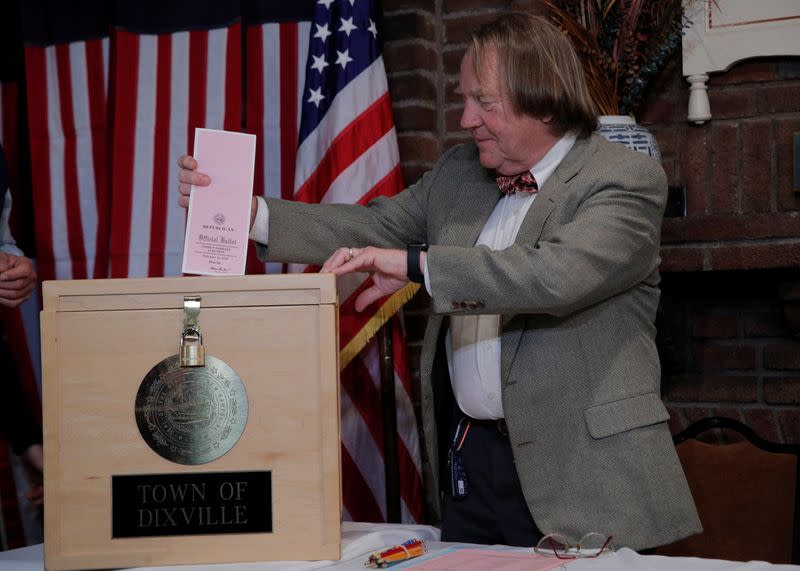 Town moderator Tom Tillotson inserts the first ballot in to the ballot box shortly after midnight in the U.S. Democratic presidential primary at the Hale House at Balsams Hotel in Dixville Notch