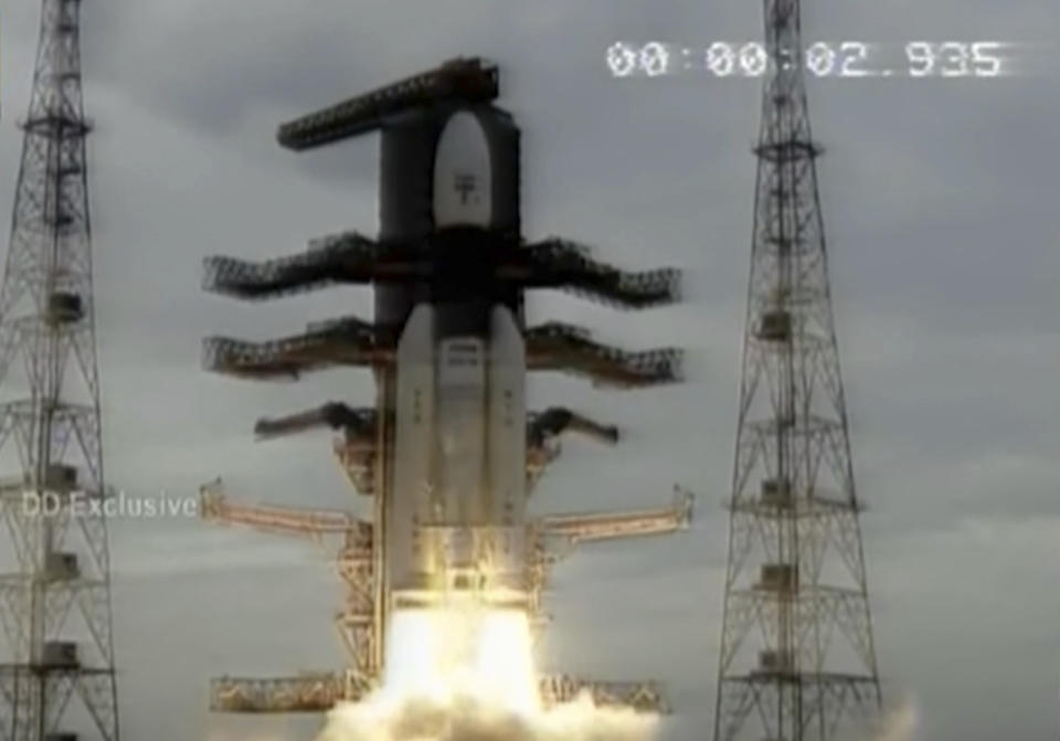 This image made from video aired by India's state owned Doordarshan television shows Indian Space Research Organization (ISRO)'s Geosynchronous Satellite launch Vehicle (GSLV) MkIII carrying Chandrayaan-2 lift of from Satish Dhawan Space center in Sriharikota, India, Monday, July 22, 2019. India's space agency says it has launched an unmanned spacecraft to the far side of the moon a week after aborting the mission due to a technical problem. (Doordarshan via AP )