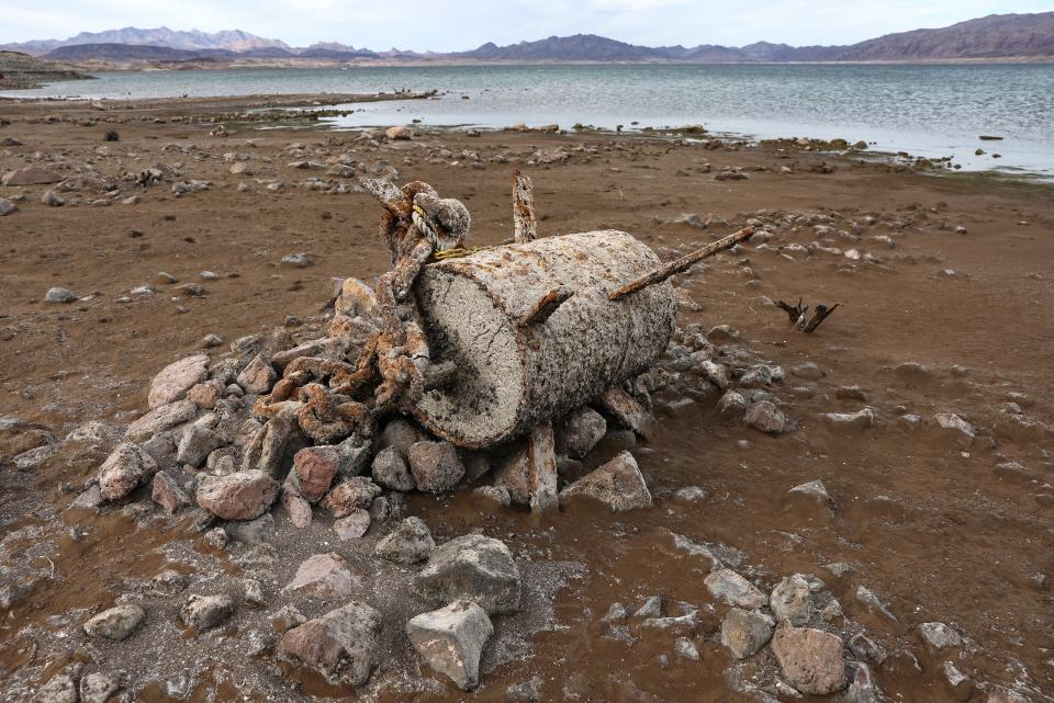 Rusted debris, which had been submerged, rests on a now-dry section of lakebed at the drought-stricken Lake Mead on May 10, 2022.