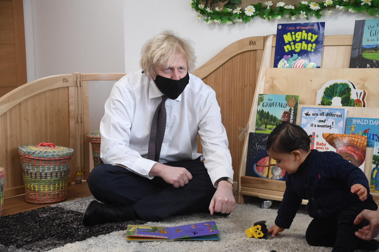 Britain's Prime Minister Boris Johnson visits the Monkey Puzzle Nursery in west London on March 25, 2021. (Photo by JEREMY SELWYN / POOL / AFP) (Photo by JEREMY SELWYN/POOL/AFP via Getty Images)