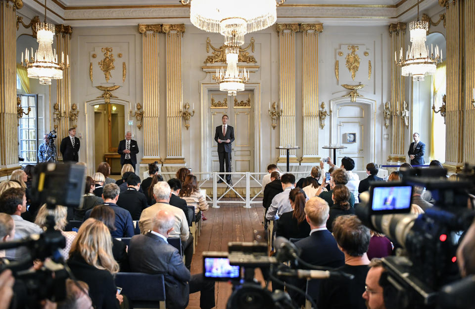 The permanent secretary of the Swedish Academy, Mats Malm, announces the winners of the 2018 and 2019 Nobel Prize in Literature in Stockholm, Sweden, Thursday Oct. 10, 2019. The 2018 Nobel Prize in literature has been awarded to Polish author Olga Tokarczuk, while the 2019 prize went to Austrian author Peter Handke. (Anders Wiklund/TT via AP)