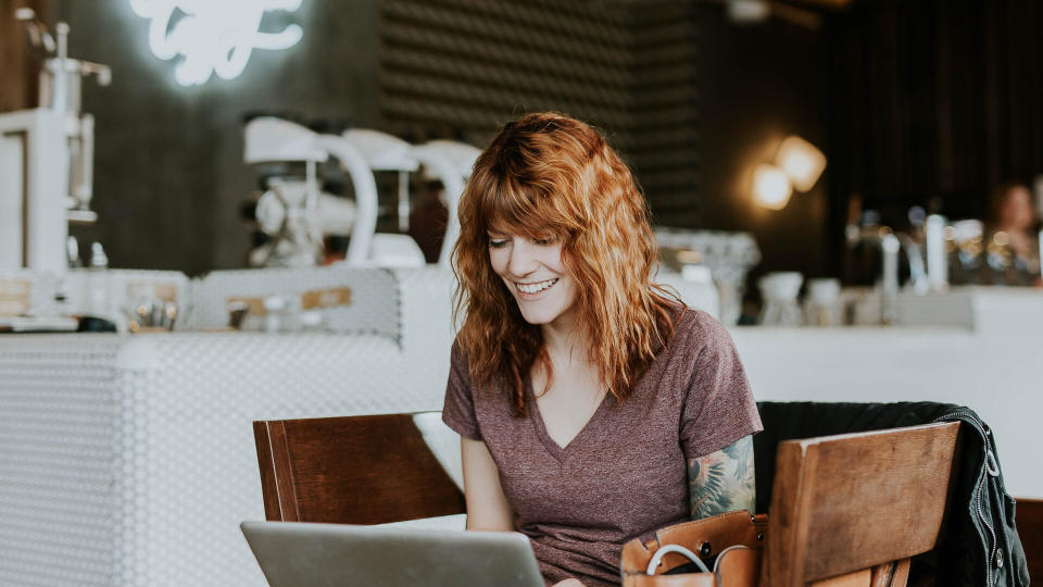 woman on laptop in coffee shop