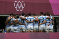 Argentina's team huddles up after winning their men's rugby sevens match against South Korea at the 2020 Summer Olympics, Tuesday, July 27, 2021 in Tokyo, Japan. (AP Photo/Shuji Kajiyama)