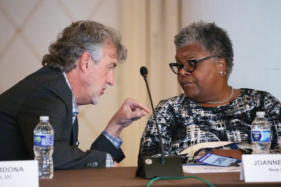 Scott Brennan, a member from Iowa of the Democratic National Committee rules and bylaws committee, left, speaks with a member from New Hampshire Joanne Dowdell before a meeting in Washington regarding the order of the presidential nominating calendar and the fate of Iowa's first in the nation caucuses. The DNC may potentially elevate states like Michigan ahead of Iowa, which has traditionally held the first caucus in the nation.