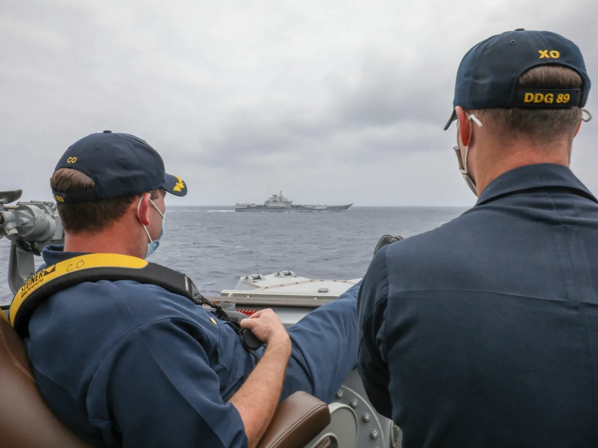 A close encounter with a Chinese aircraft carrier has become a badge of honor for a US Navy destroyer crew