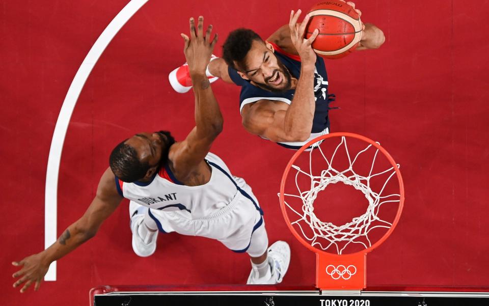 Rudy Gobert #27 of Team France dunks against Kevin Durant #7 of Team United States during the first half of a Men's Basketball Finals. - Aris Messinis - Pool/Getty Images