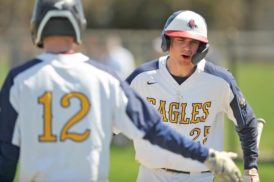 Barrington's Matt Davis, right, in action earlier this season, had a single and double and three RBI as the Eagles defeated Middletown in their Division II playoff game on Friday.