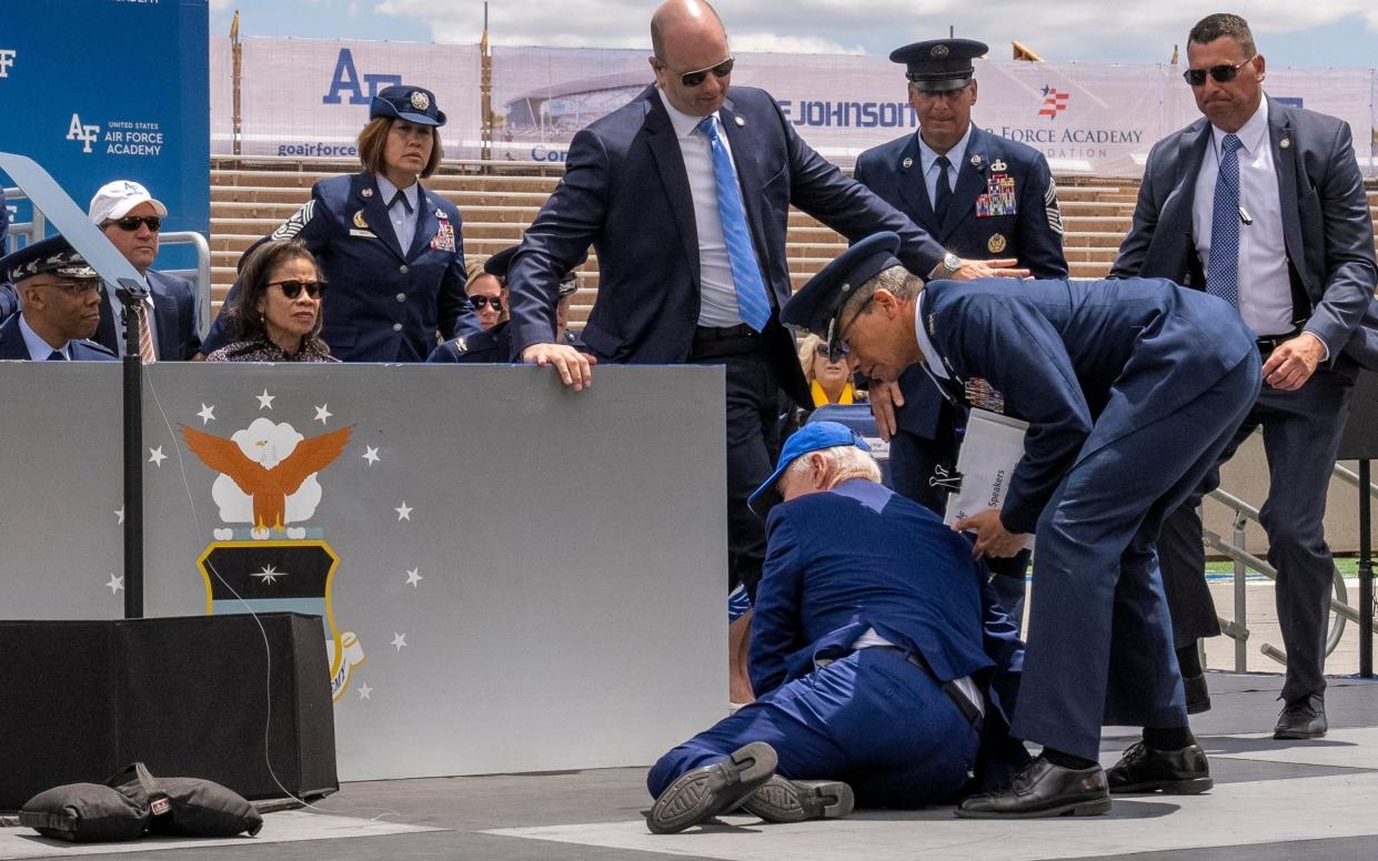 President Joe Biden falls on stage during the 2023 United States Air Force Academy Graduation Ceremony - Andrew Harnik