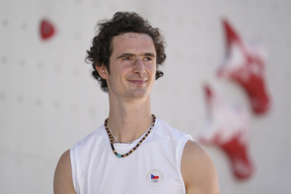 Adam Ondra, of the Czech Republic, smiles after completing the second heat during the speed qualification portion of the men's sport climbing competition at the 2020 Summer Olympics, Tuesday, Aug. 3, 2021, in Tokyo, Japan. (AP Photo/Jeff Roberson)