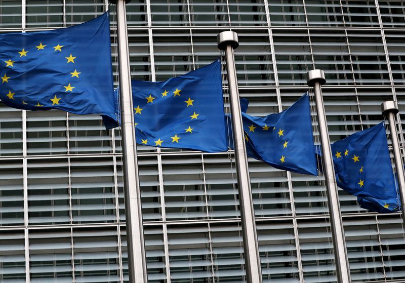 FILE PHOTO: EU flags fly outside the European Commission headquarters in Brussels