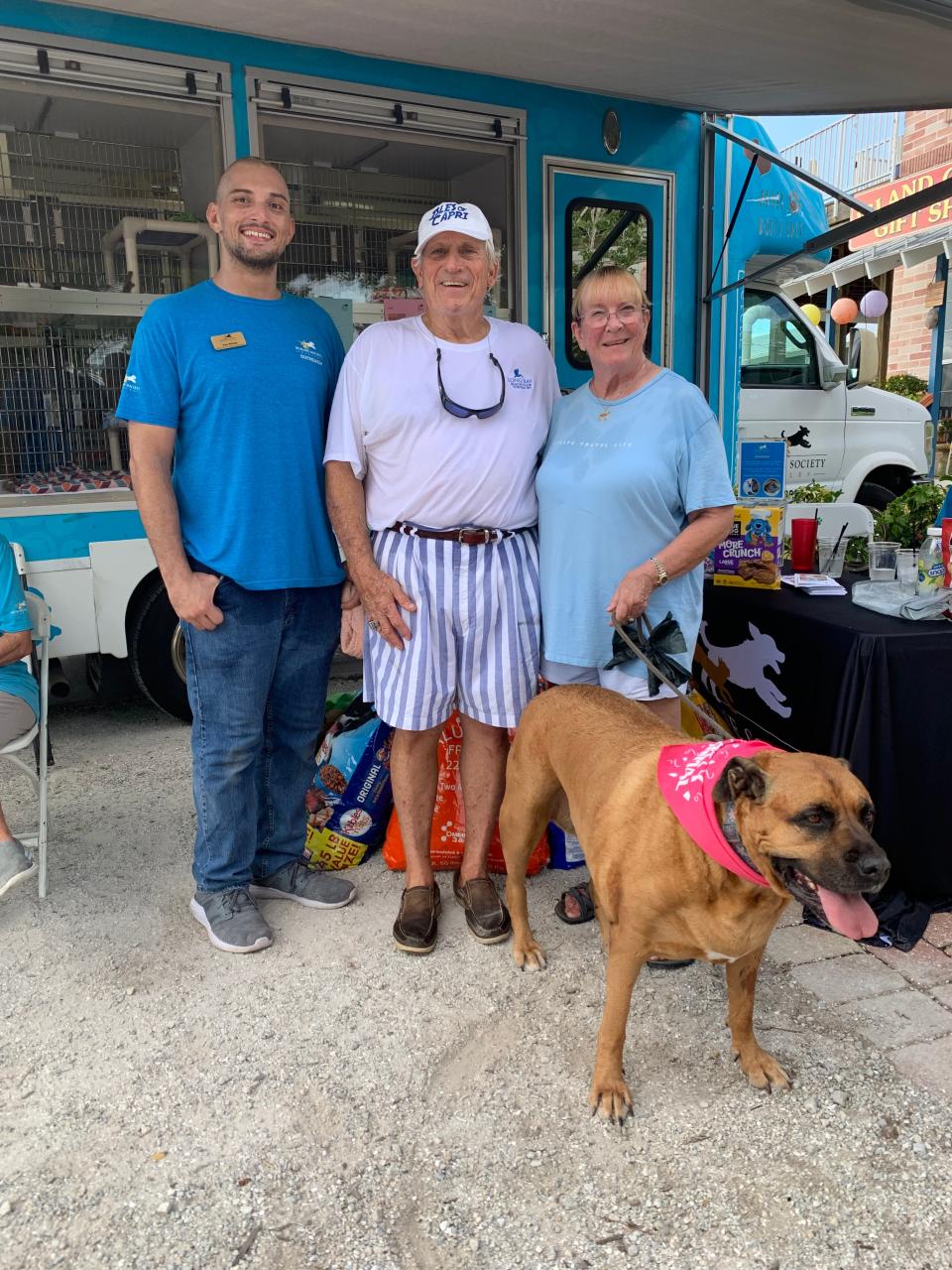From L to R: Alex Woods (Humane Society Naples: Paws Around Town Coordinator), Michael Cochran, Gail Cochran, and Gypsy Sue, the birthday pup at Island Gypsy.