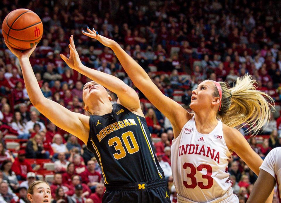 Michigan's Elise Stuck (30) shoots over Indiana's Sydney Parrish (33) during the first half of the Indiana versus Michigan women's basketball game on Thursday, Jan. 4, 2024.