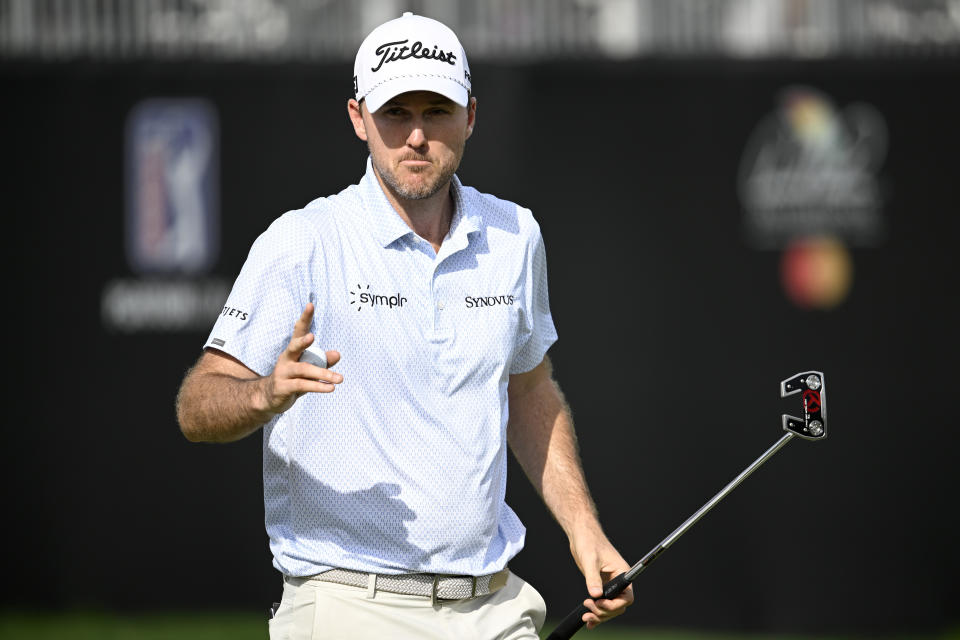 Russell Henley acknowledges the crowd after making his putt on the 14th green during the second round of the Arnold Palmer Invitational golf tournament, Friday, March 8, 2024, in Orlando, Fla. (AP Photo/Phelan M. Ebenhack)