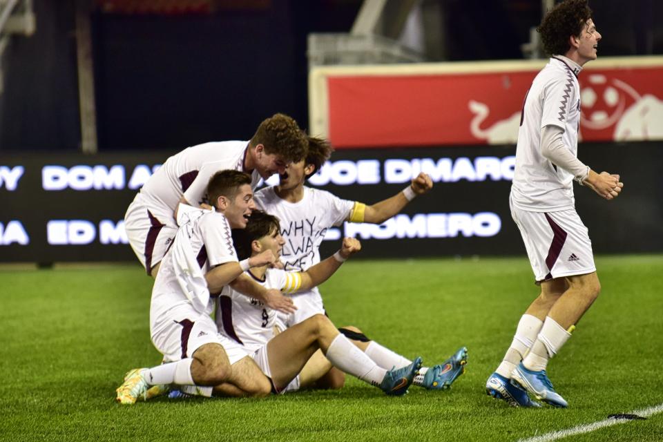 Brandon Gjekaj, #9, of Becton is congratulated by his teammates following his winning goal against of Wood-Ridge, 2-1 in overtime during their game at Red Bull Arena in Harrison, Monday on 10/10/22.