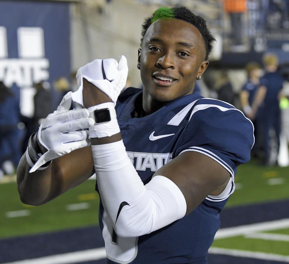 Utah State safety Ike Larsen celebrates the team’s win over Colorado State in an NCAA college football game Saturday, Oct. 7, 2023, in Logan, Utah. | Eli Lucero/The Herald Journal via AP