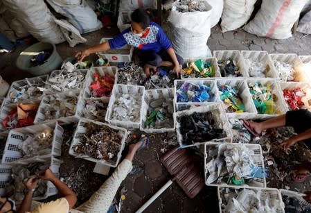 The Wider Image: Cash for trash: Indonesia village banks on waste recycling