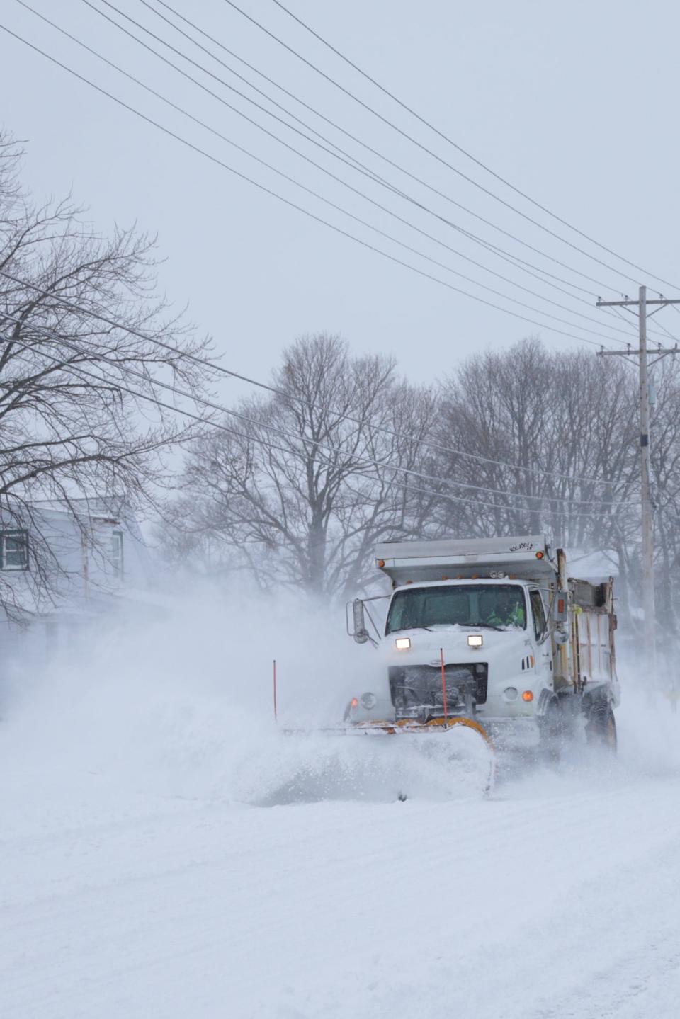 A City of Lafayette snow plow moves snow along McCarty Lane, Thursday, Feb. 3, 2022 in West Lafayette.