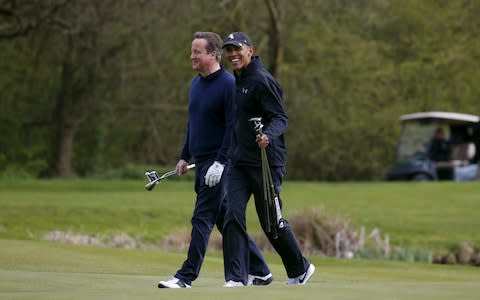 On the golf course in April 2016 during Mr Obama's UK visit - Credit: Reuters