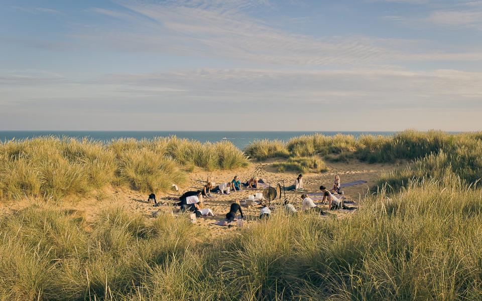 Guests at The Gallivant Camber Sands practice yoga: the hotel will open an outpost in Littlestone in 2024