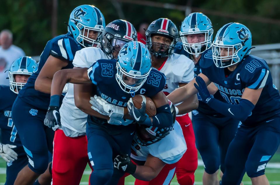 Central Valley's Landon Alexander pulls several New Castle players with him in the first quarter of their game earlier this season at Sarge Alberts Stadium. [Lucy Schaly/For BCT]