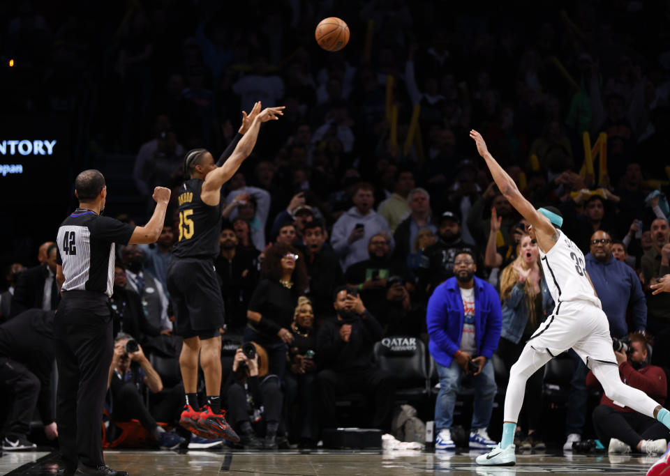 Cleveland Cavaliers forward Isaac Okoro makes the game winning shot against Brooklyn Nets center Nic Claxton during the second half of an NBA basketball game, Thursday, March 23, 2023, in New York. The Cleveland Cavaliers won 115 - 109. (AP Photo/Noah K. Murray)