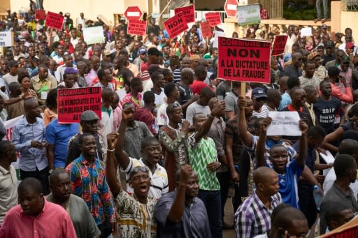 Demonstrators take part in a protest against incumbent Malian President Ibrahim Boubacar Keita in Bamako on August 11, the eve of the second round of presidential elections