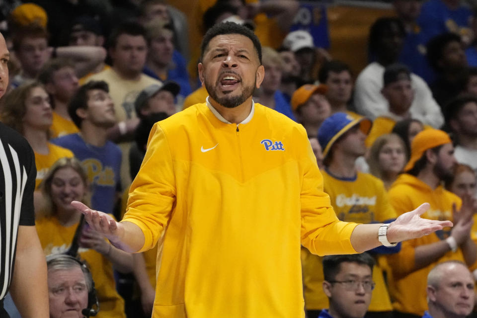 Pittsburgh head coach Jeff Capel questions an official during the first half of an NCAA college basketball game against Virginia in Pittsburgh, Tuesday, Jan. 3, 2023. (AP Photo/Gene J. Puskar)