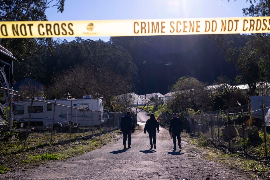 FBI officials walk towards the crime scene on Jan. 24, 2023, after a gunman killed several people in Half Moon Bay. (AP Photo/Aaron Kehoe)