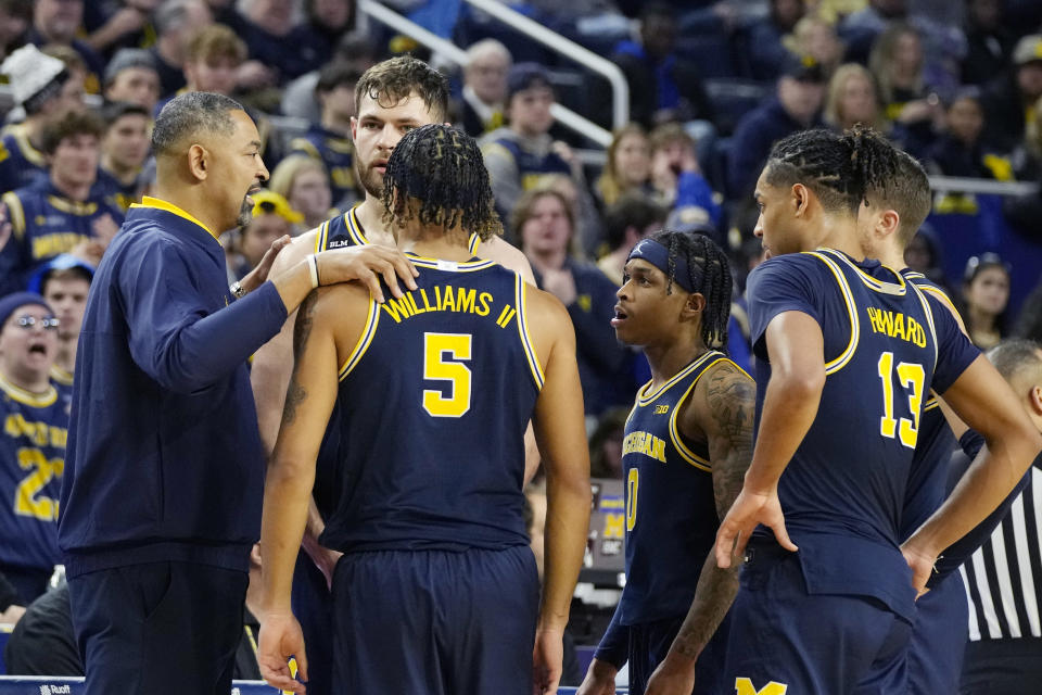 Michigan head coach Juwan Howard talks to his team during the first half of an NCAA college basketball game against Ohio State, Sunday, Feb. 5, 2023, in Ann Arbor, Mich. (AP Photo/Carlos Osorio)