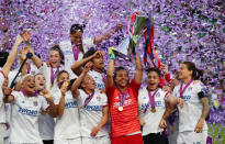 Soccer Football - Women's Champions League Final - Ferencvaros Stadium, Budapest, Hungary - May 18, 2019 Olympique Lyonnais' Sarah Bouhaddi and team mates celebrate winning the Women's Champions League with the trophy REUTERS/Lisi Niesner