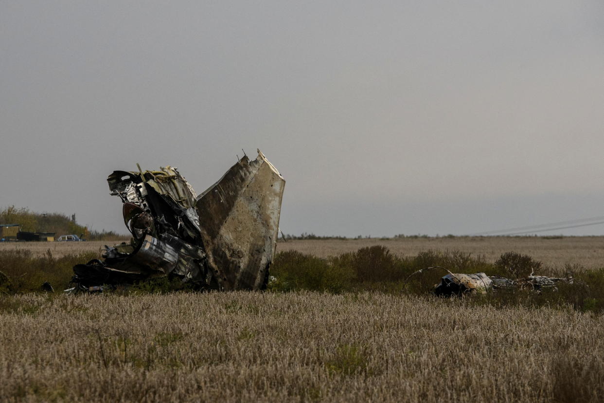 The wreckage of a Russian aircraft shot down in a field.