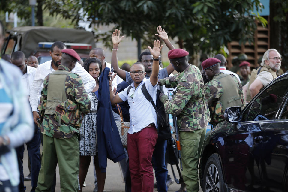 Kenyan armed forces rescue people after an attack on a hotel, in Nairobi, Kenya, Tuesday, Jan. 15, 2019. Extremists launched a deadly attack on a luxury hotel in Kenya's capital Tuesday, sending people fleeing in panic as explosions and heavy gunfire reverberated through the complex. A police officer said he saw bodies, "but there was no time to count the dead." (AP Photo/Brian Inganga)