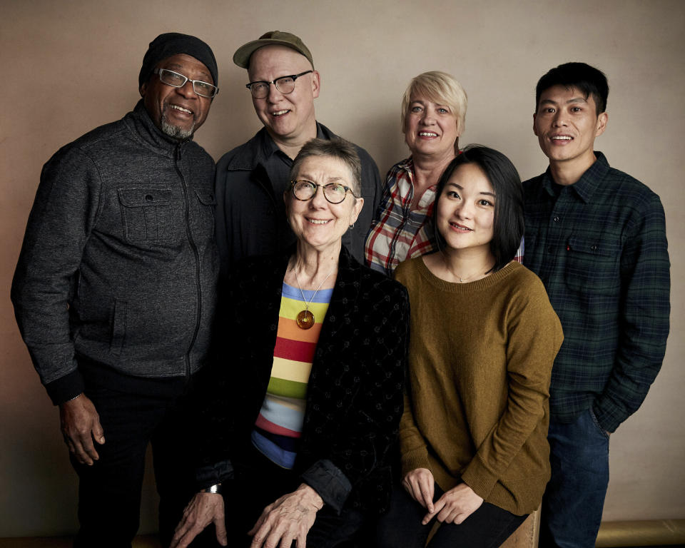 FILE - In this Saturday, Jan. 26, 2019 file photo, Bobby Allen, from top left, director Steven Bognar, Jill Lamantia, Wong He, director Julia Reichert, bottom left, and producer Yiqian Zhang pose for a portrait to promote the film "American Factory" at the Salesforce Music Lodge during the Sundance Film Festival, in Park City, Utah. The documentary about an Ohio auto glass factory that is run by a Chinese investor debuted Wednesday, Aug. 21, 2019, on Netflix, as the streaming service's first project backed by Michelle and Barack Obama's new production company. (Photo by Taylor Jewell/Invision/AP, File)