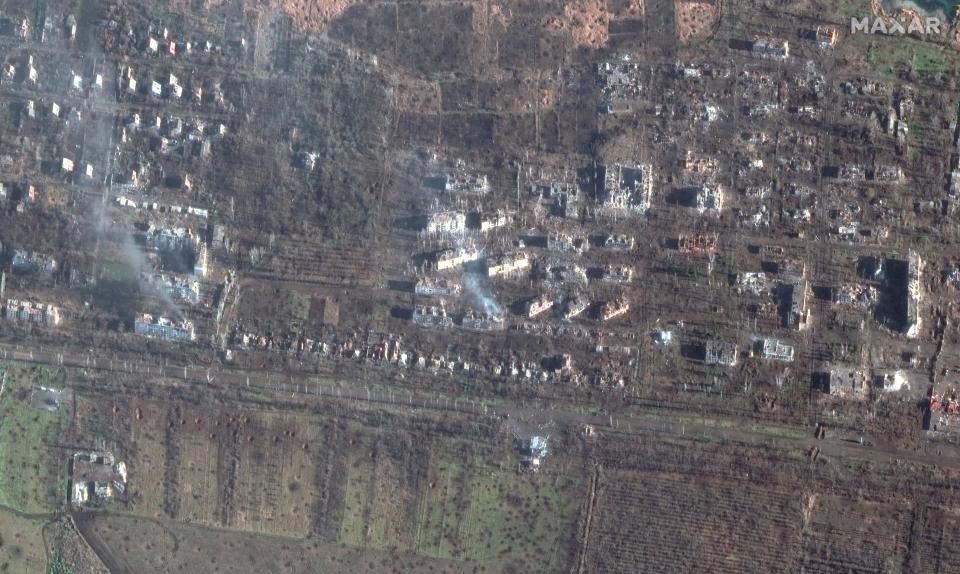 Satellite images show destroyed apartment buildings and craters in fields of southern Bakhmut in Ukraine on Wednesday (Satellite image ©2023 Maxar Technologies)