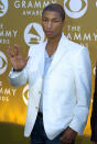 FILE - Pharrell Williams arrives at the 46th Annual Grammy Awards in Los Angeles on Feb. 8, 2004. Pharrell remembers working with Johnta Austin in the early 90s, telling the AP: “Johnta just had an incredible (gift and he) still has an amazing voice, and he’s a great writer. He was talented then, at 14.” (AP Photo/Mark J. Terrill, File)