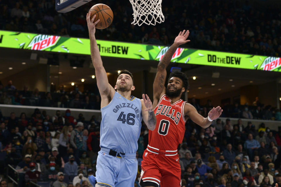 Memphis Grizzlies guard John Konchar (46) shoots the ball against Chicago Bulls guard Coby White (0) in the first half of an NBA basketball game Monday, Jan. 17, 2022, in Memphis, Tenn. (AP Photo/Brandon Dill)