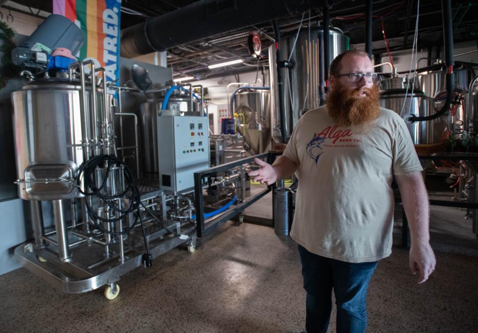 Co-owner Brett Reid gives a tour of the equipment which will be used to make hard seltzer for the '80s themed Florida Room cocktail bar at the Alga Beer Company in Pensacola on Wednesday, Jan. 4, 2023. The owners are planning on opening the new cocktail bar later this year.
