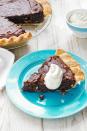 <p>North Carolina is known as the Tar Heel State, referring to its pine forests that produce large quantities of tar products. This pie's rich brownie filling is just as thick and dark as the state's namesake resource.</p><p><strong><a href="https://www.countryliving.com/food-drinks/recipes/a31428/tar-heel-pie-recipe-wdy1112/" rel="nofollow noopener" target="_blank" data-ylk="slk:Get the recipe for Tar Heel Pie" class="link ">Get the recipe for Tar Heel Pie</a>.</strong></p>